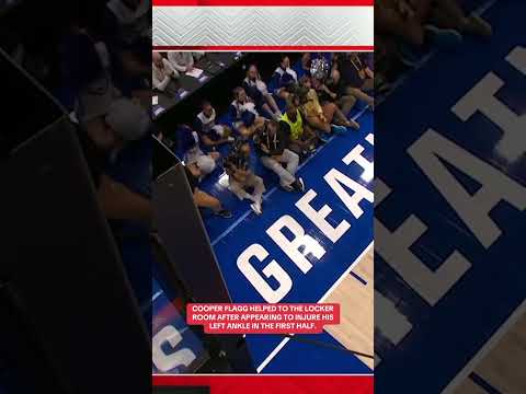 Cooper Flagg helped to the locker room after appearing to injure his ankle